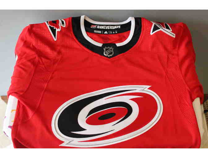 Jaccob Slavin Autographed Jersey and Game Used Stick